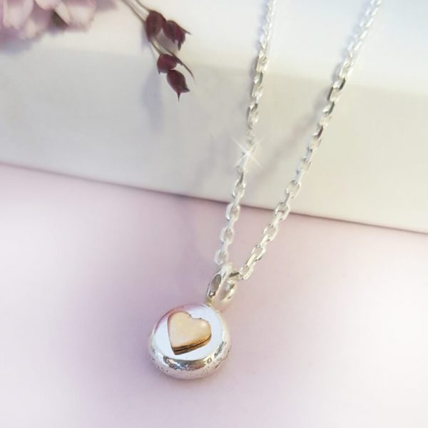 RAW silversmycke med guldhjärta