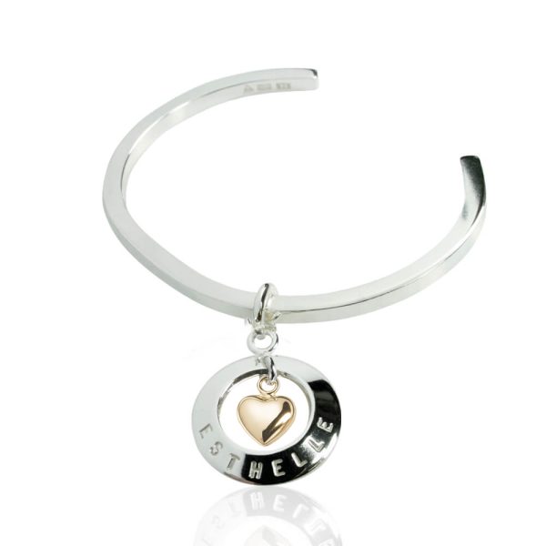 Stelarmring med cirkel hängandes och guldhjärta