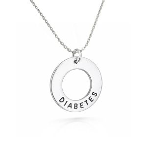 Cirkelformat mindre smycke med medicinsk text