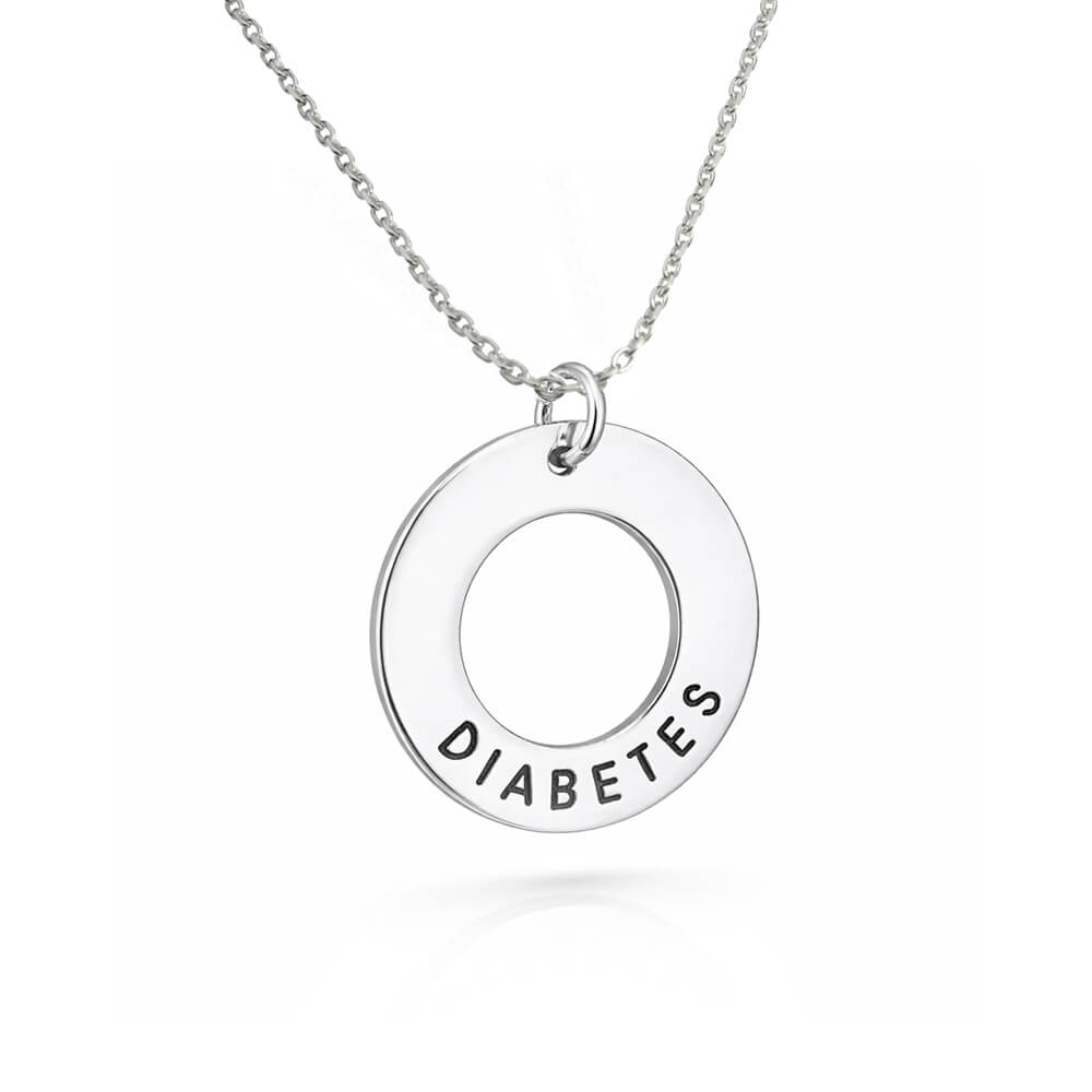 Cirkelformat mindre smycke med medicinsk text